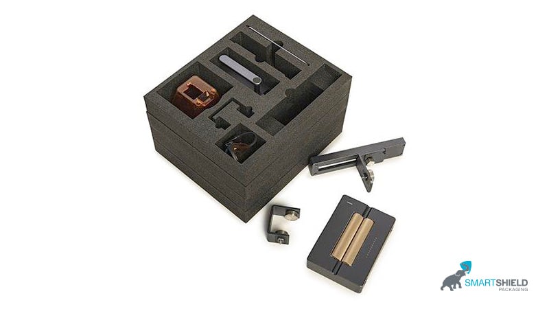 Heavy duty crate with custom-cut packaging inserts