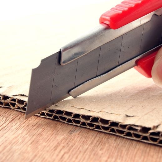 cardboard pad - utility knife shutterstock_368393267-1