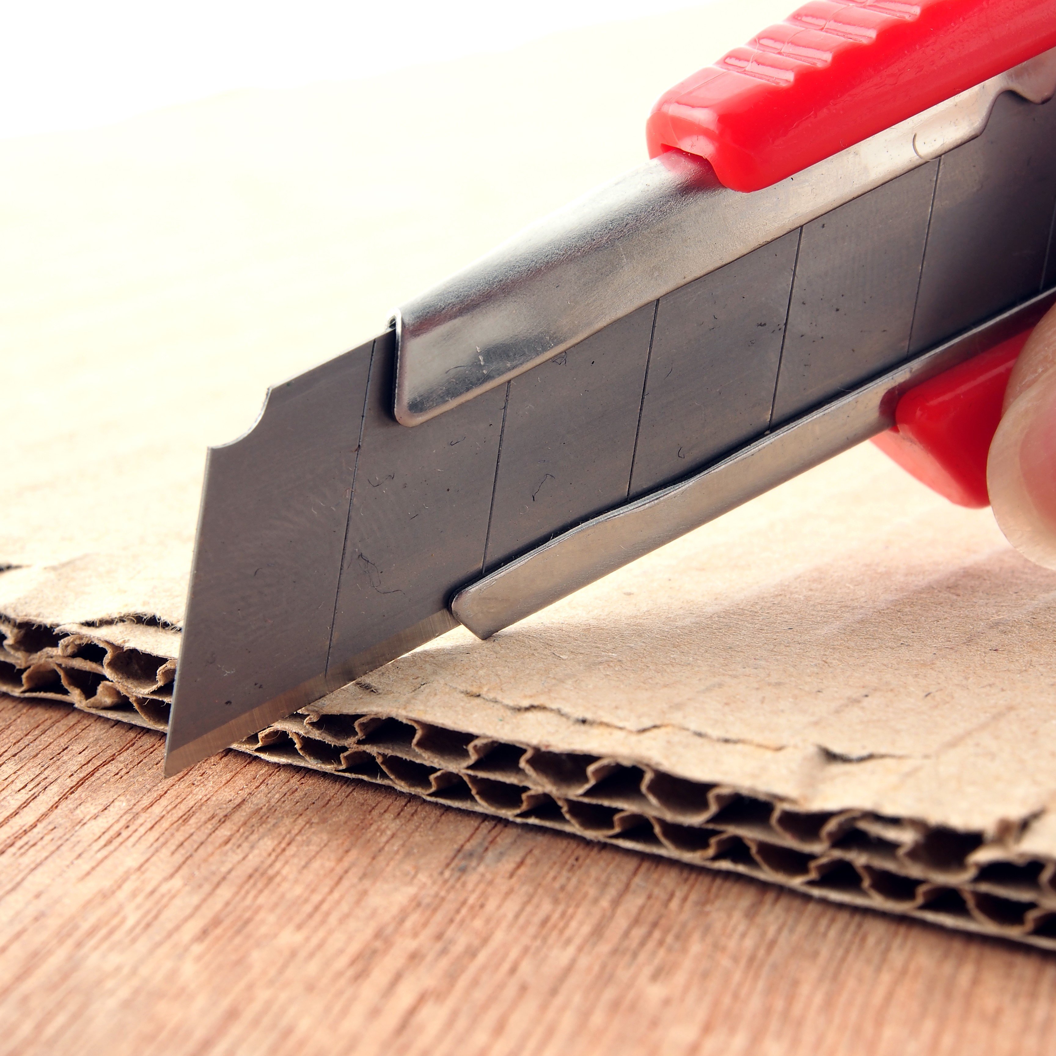 cardboard pad - utility knife shutterstock_368393267